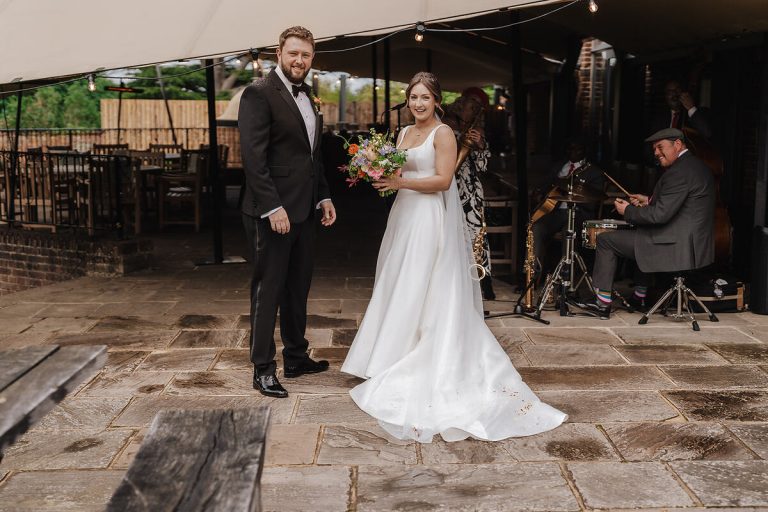 Soaking in their newlywed status, Annabel + Joe enjoy couple time during their drinks reception at Wasing Park