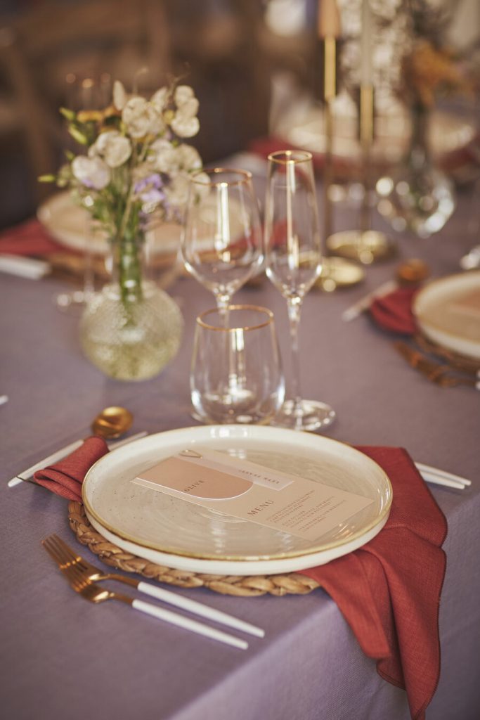 A contemporary wedding palette of lilac, mauve and burnt orange for vineyard wedding inspired by the Mediterranean sunset