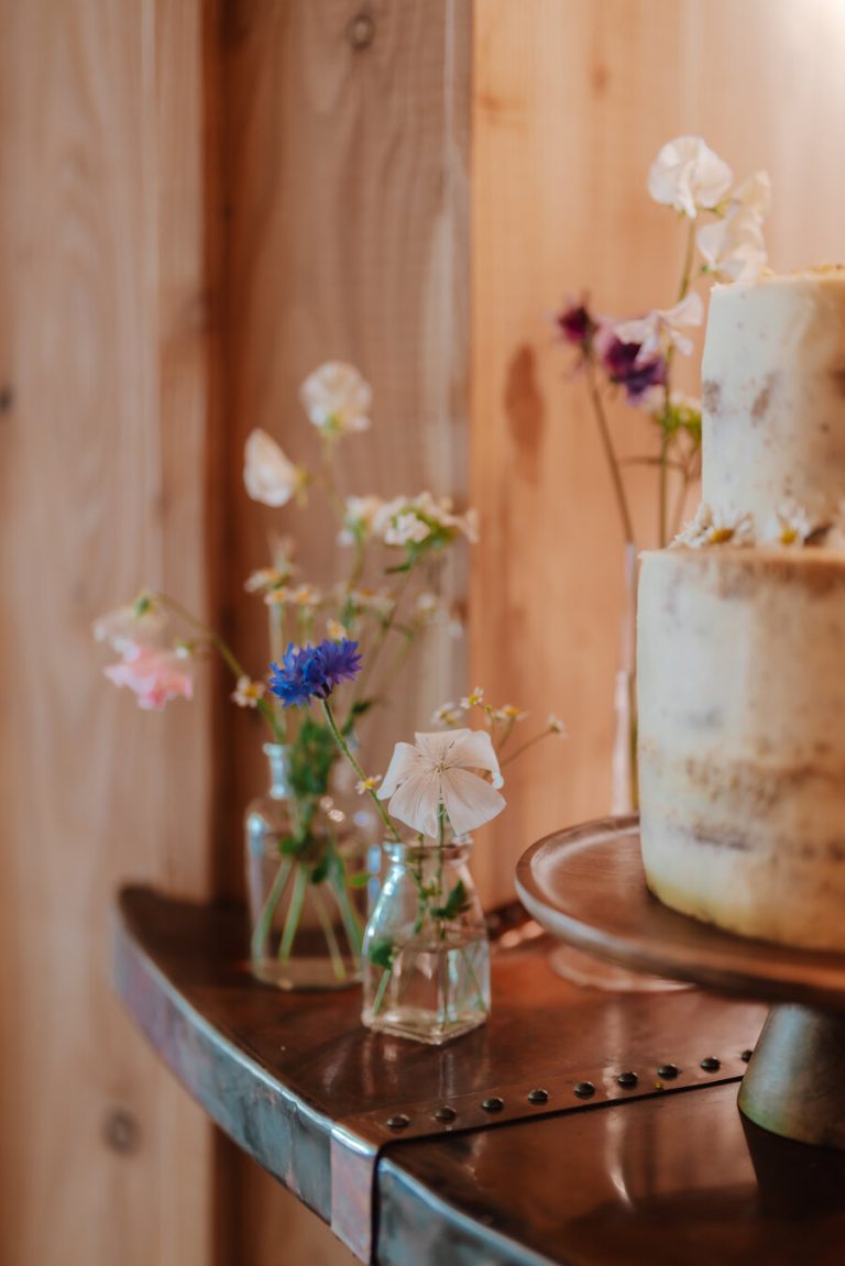 Understated styling with a hint of wildflowers for an intimate woodland wedding