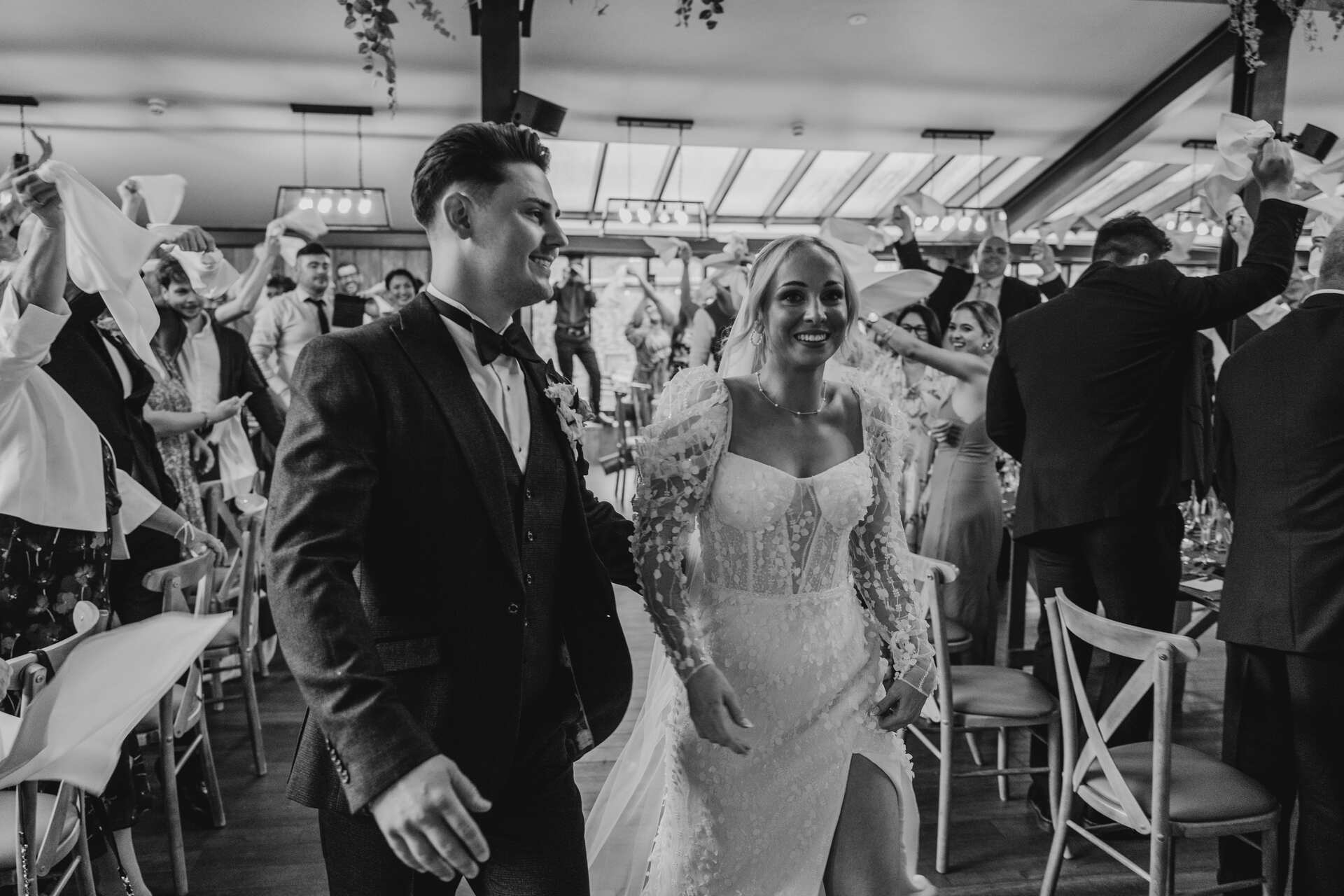 A napkin waving celebration to welcome in the newlyweds at Foxtail Barns