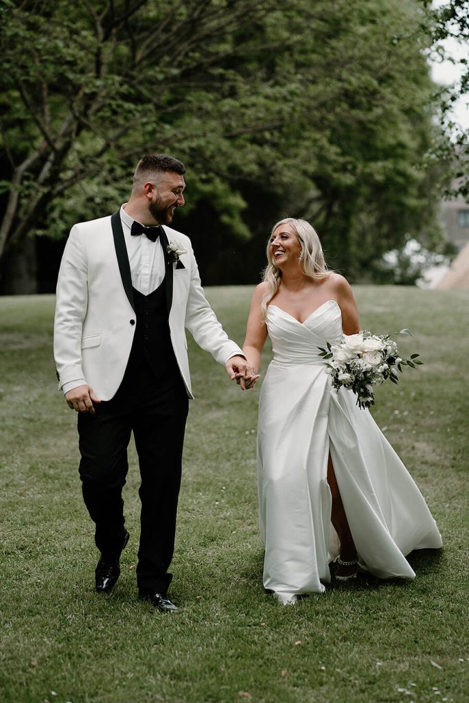 Kirsty and Sam | Newlyweds enjoying a moment of alone time in the grounds of their country estate wedding venue