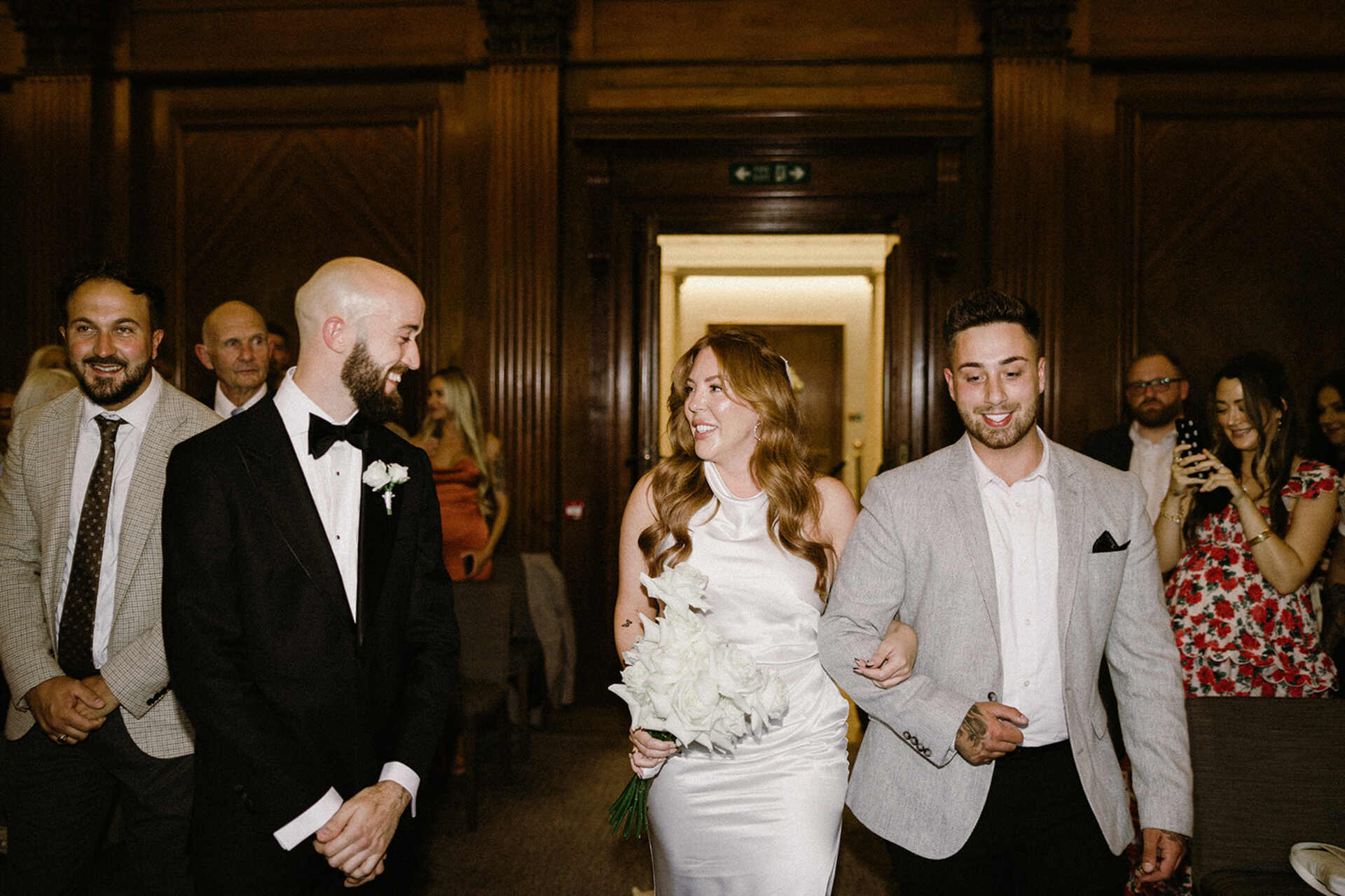 Bride Angelique making her way into Old Marylebone Town Hall's ceremony room to marry her soul mate