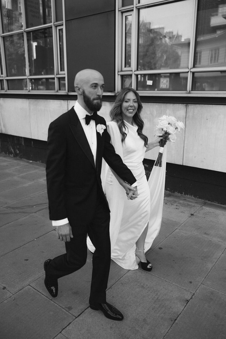 Angelique + John wandering the street's of London during their city wedding