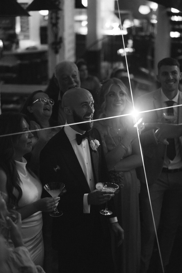 Flash light lit informal speeches during Angelique + John's informal city wedding