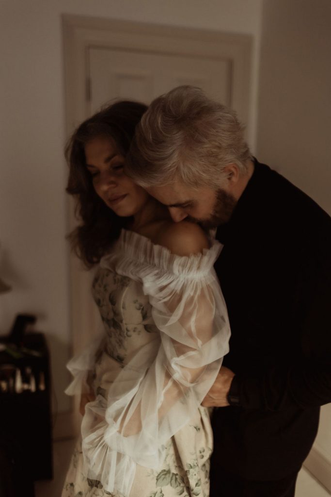 A bride and groom get ready together on the morning of their wedding with a tender intimacy and deep connection