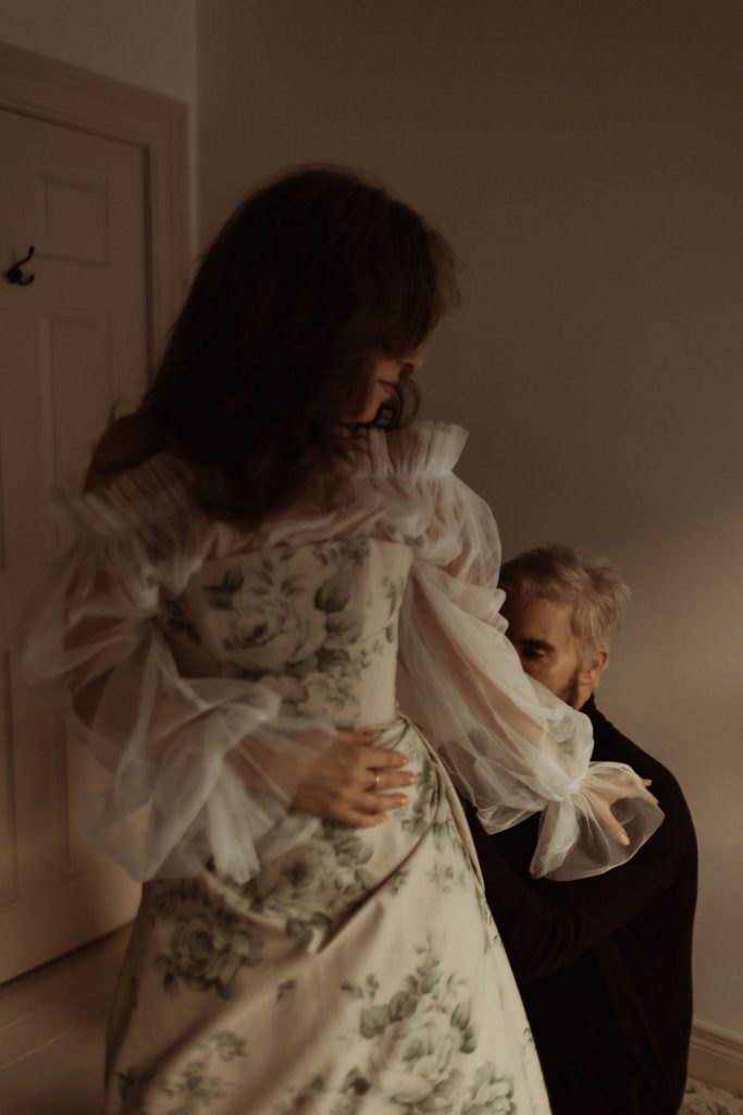 A bride and groom get ready together on the morning of their wedding with a tender intimacy and deep connection