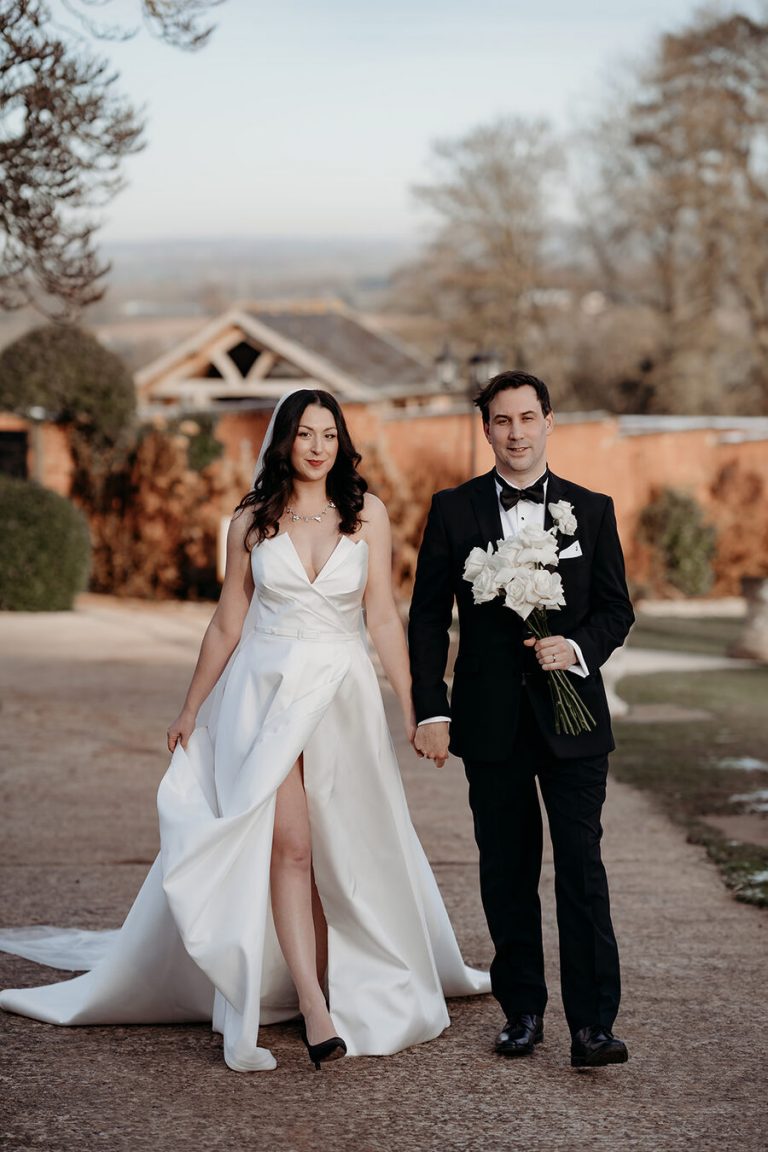 A moment of reflection for the newlyweds Rebecca + Jeremy as they stroll the grounds of Upton Barn during their winter wedding