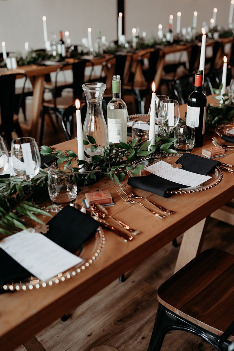 Elegant, contemporary winter wedding styling at Devonshire's Upton Barn with a green and white palette and a mass of mirror balls
