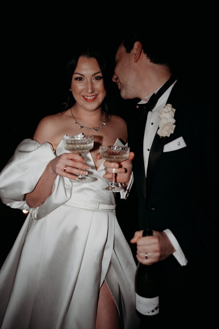 A Champagne moment for the newlyweds Rebecca + Jeremy during their winter wedding at Upton Barn