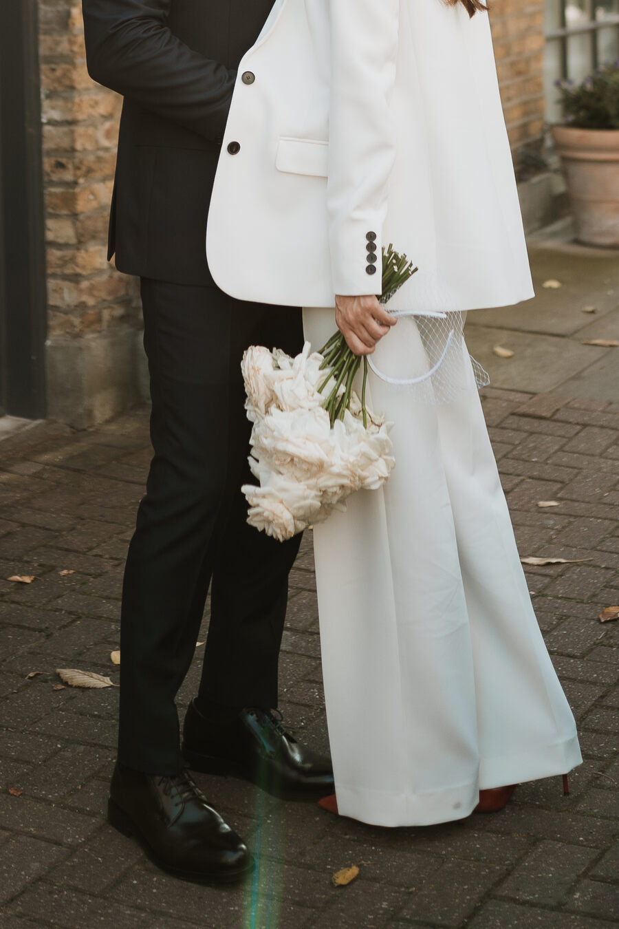 A chic tailored white bridal suit from The Kooples for cool London bride Lauren