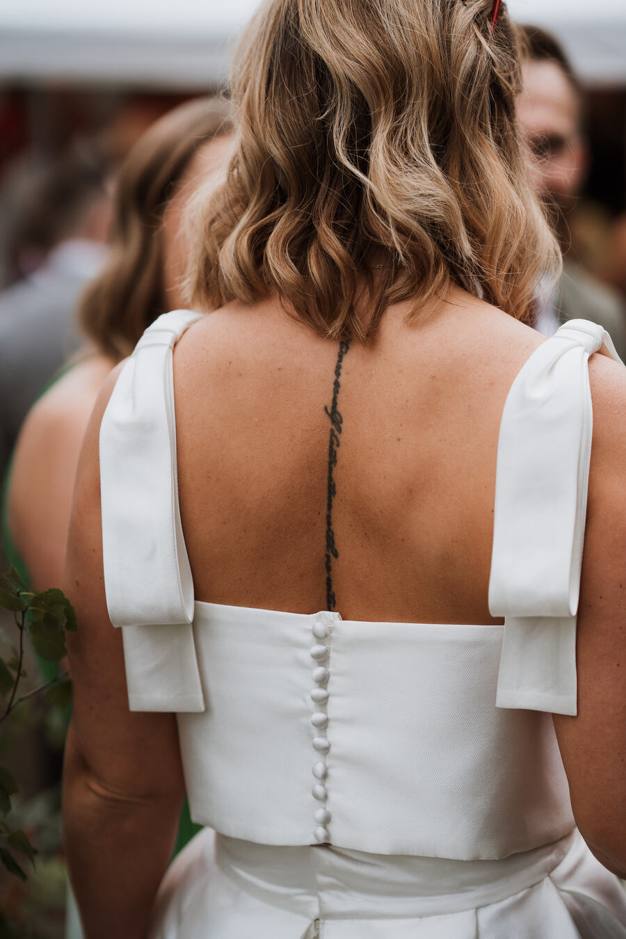 Summer bride Sophie looking radiant in a two piece custom made Jesus Peiro bridal outfit of a sleeveless top and skirt.