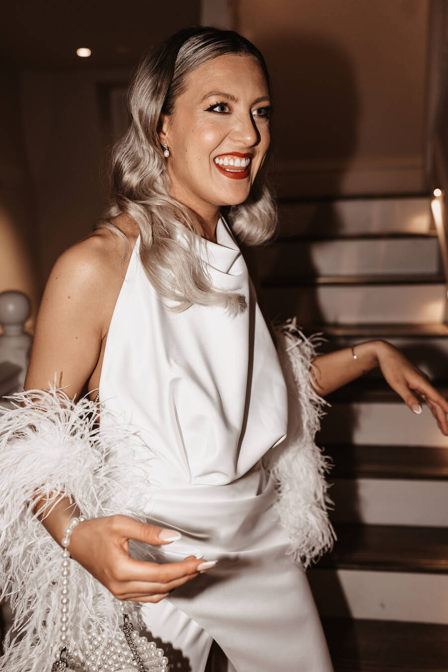 Bride Monda wearing a halterneck sassy Milla evening outfit change backless dress