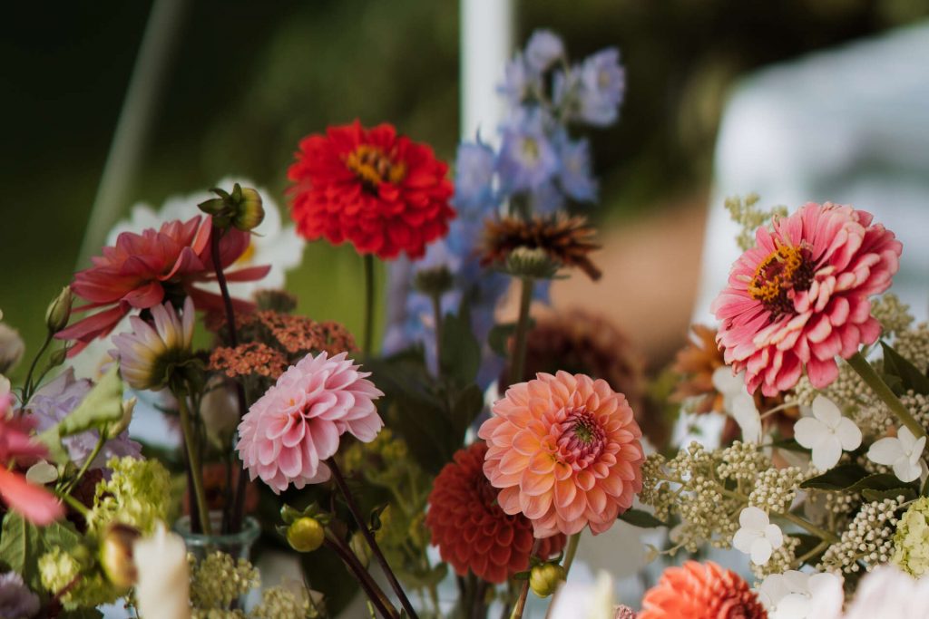 Gloriously colourful fresh blooms for a laid-back summer garden party wedding