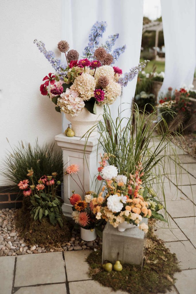 Gloriously colourful fresh blooms for a laid-back summer garden party wedding