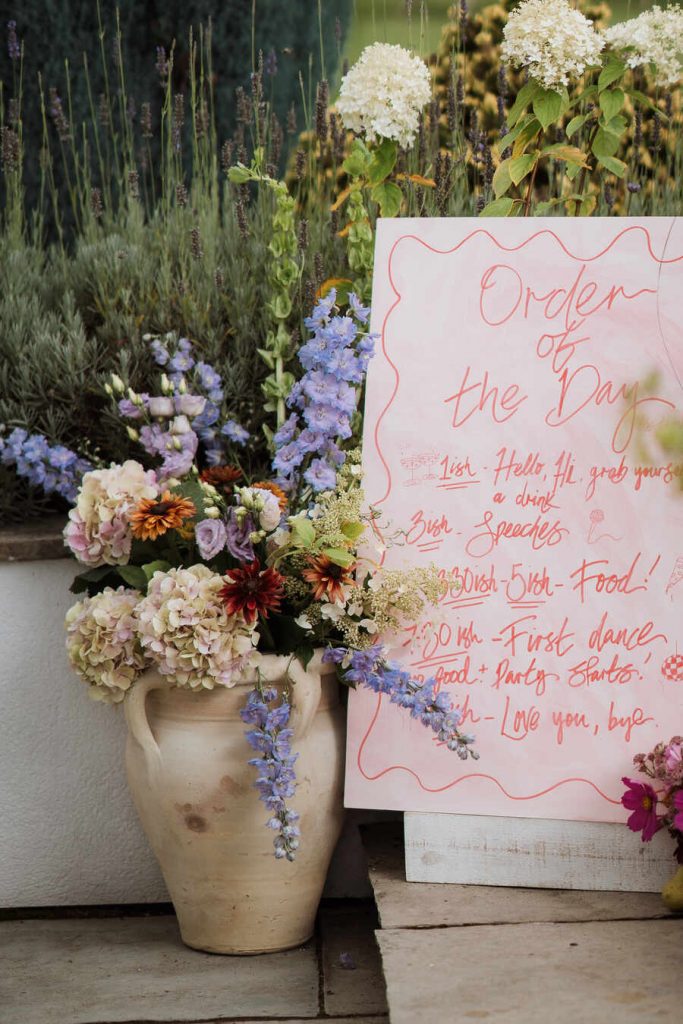 Gloriously colourful fresh blooms for a laid-back summer garden party wedding