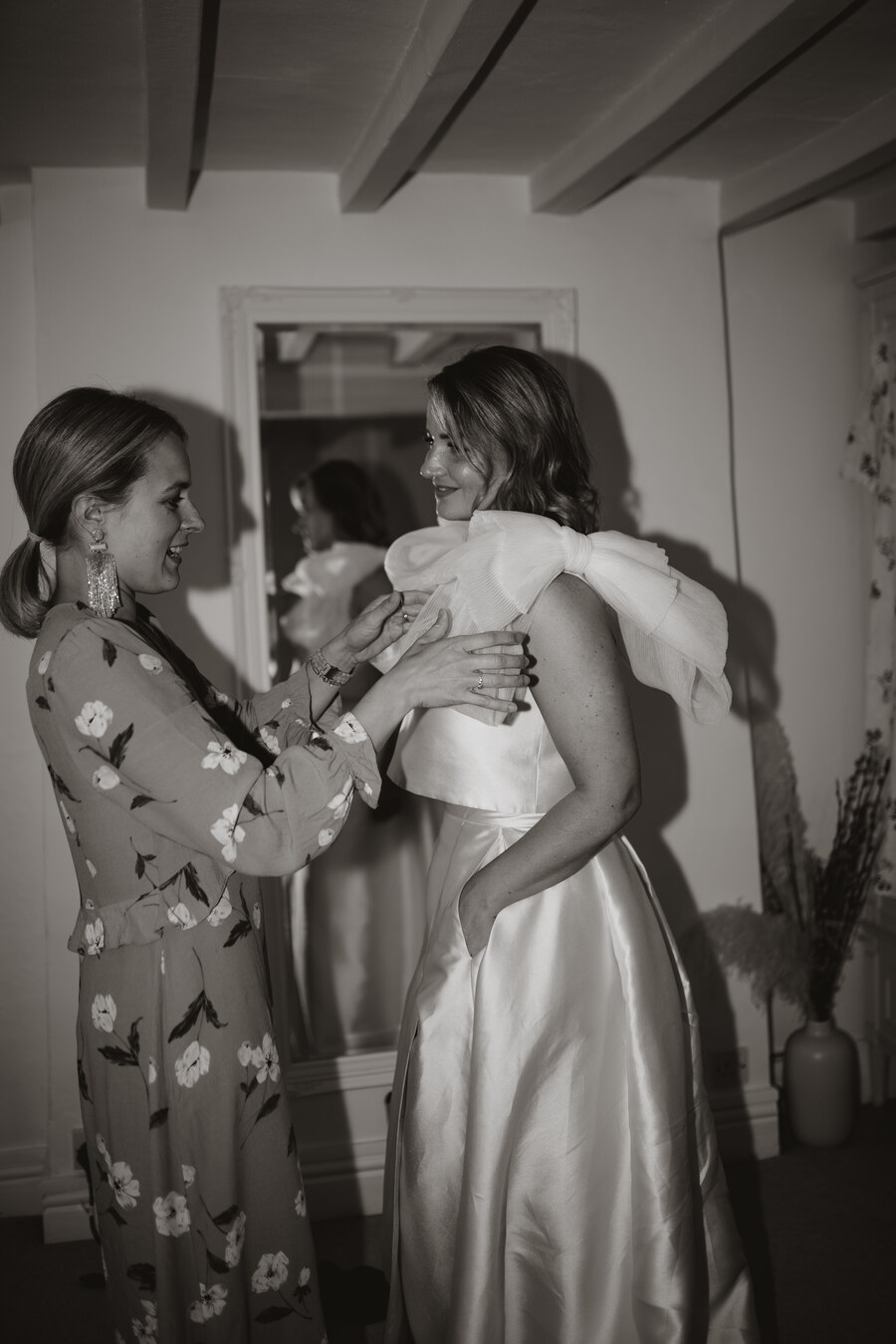 Summer bride Sophie looking radiant in a two piece custom made Jesus Peiro bridal outfit of a sleeveless top and skirt.