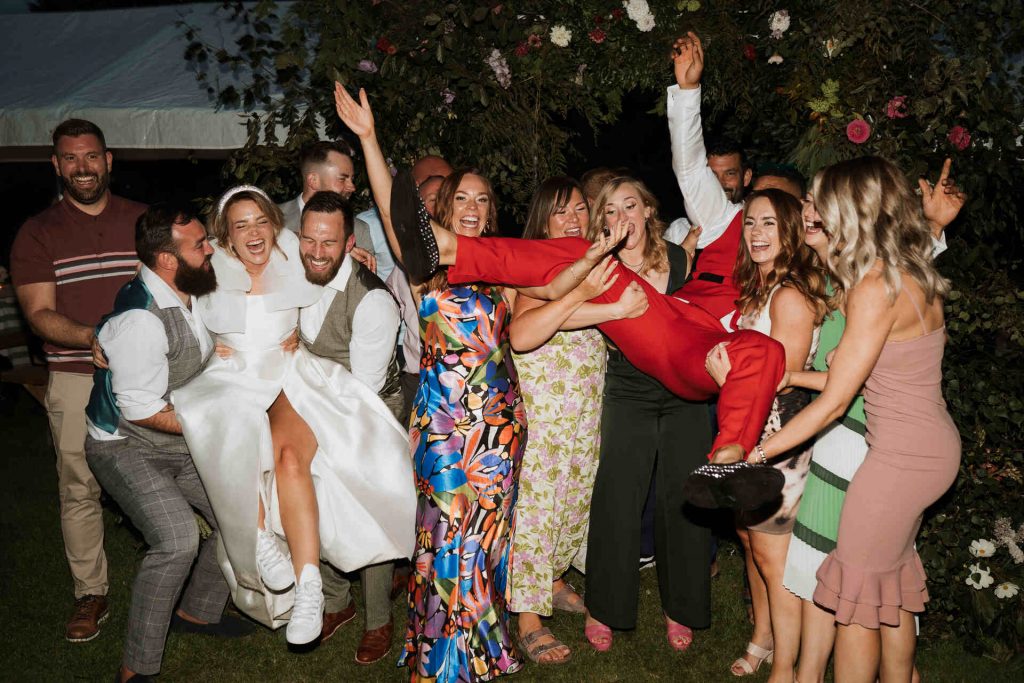 Gloriously colourful fresh blooms for a laid-back summer garden party wedding