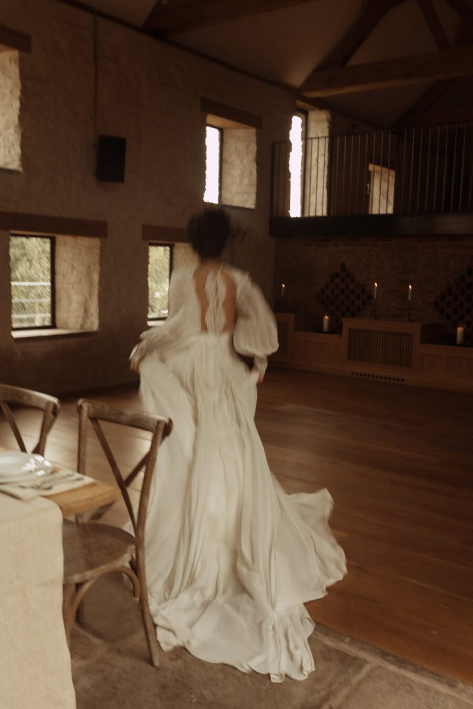 Highlighting the beautiful movement of Julita London's Moon Vine gown as the fabric billows and flows