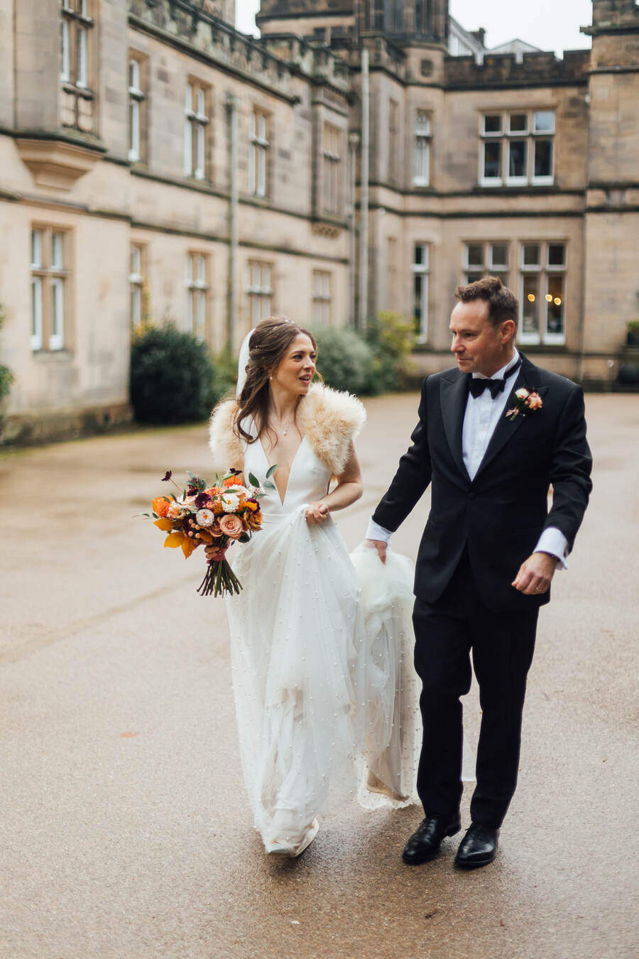 Bride Lucy's elegant and minimal bridal style wearing a pearl scattered Maggie Sottero wedding gown