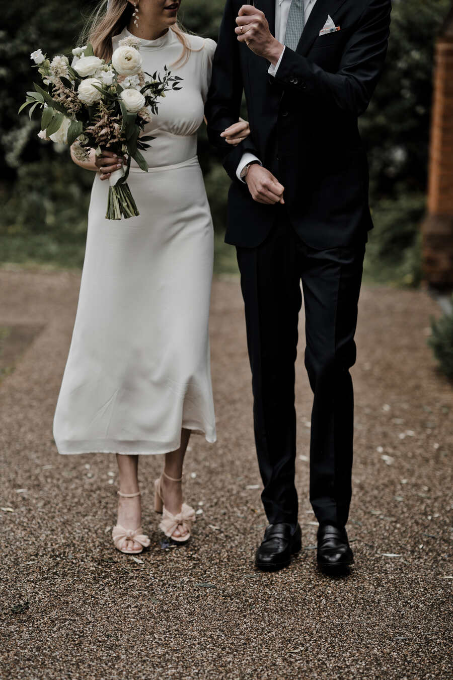 A Reformation dress, Eden B bridal bow and Loeffler Randall pleated heels for London bride Lucy