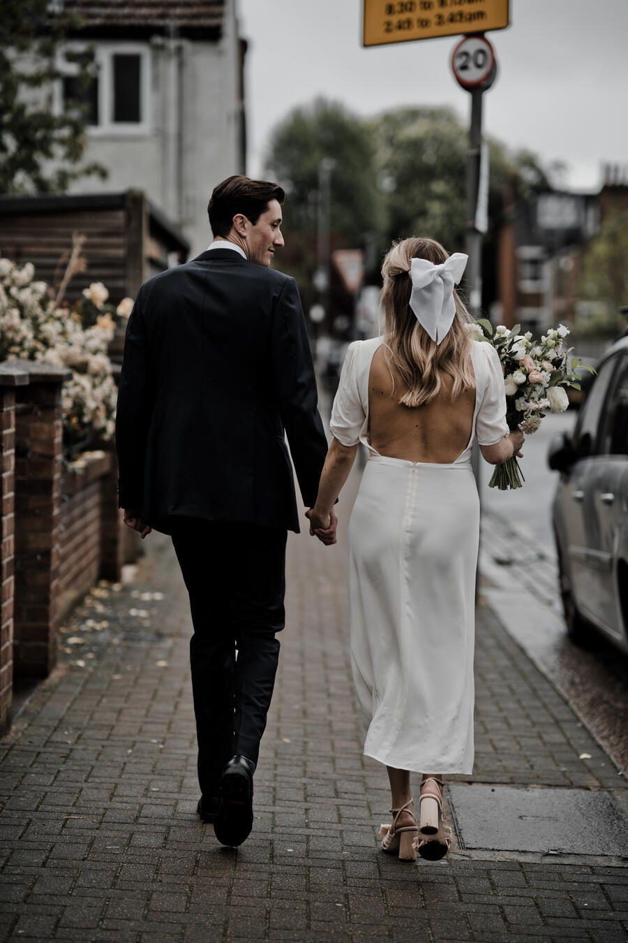 A Reformation dress, Eden B bridal bow and Loeffler Randall pleated heels for London bride Lucy