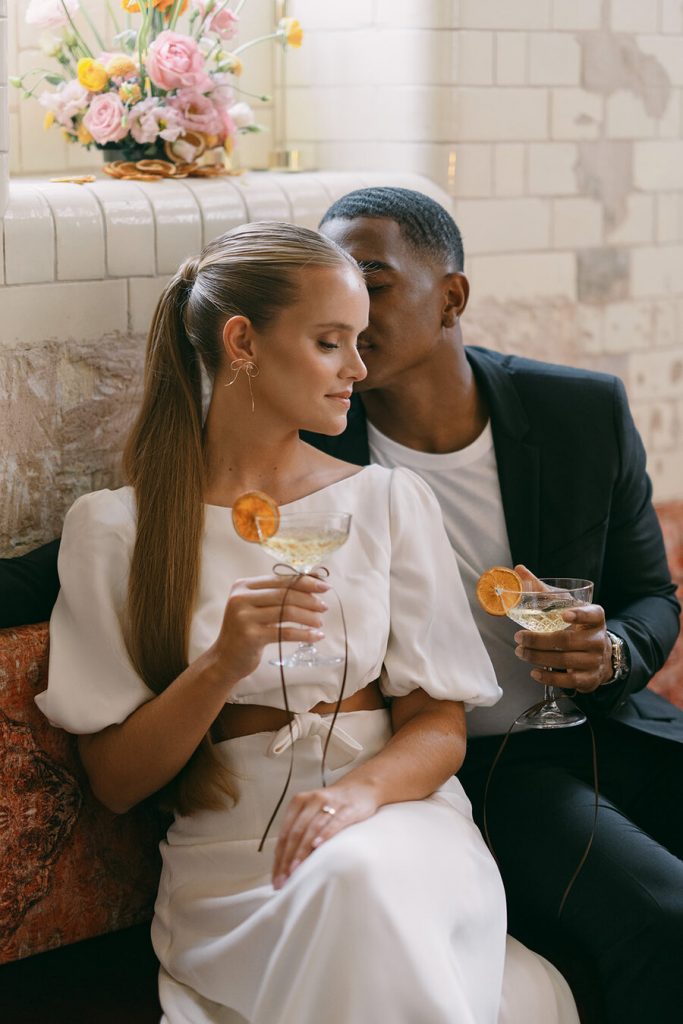 Colourful wedding scenes in a zesty palette of pinks, oranges and yellows at London's Yaatra Restaurant | Lynn Shapiro Photography