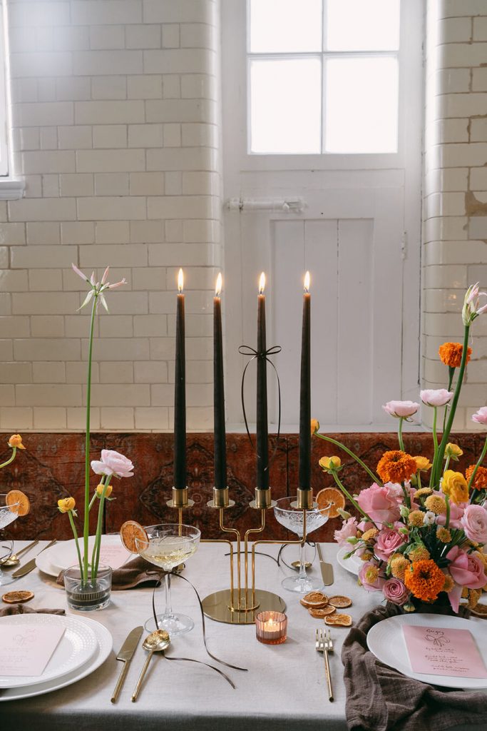 Colourful wedding scenes in a zesty palette of pinks, oranges and yellows at London's Yaatra Restaurant | Lynn Shapiro Photography