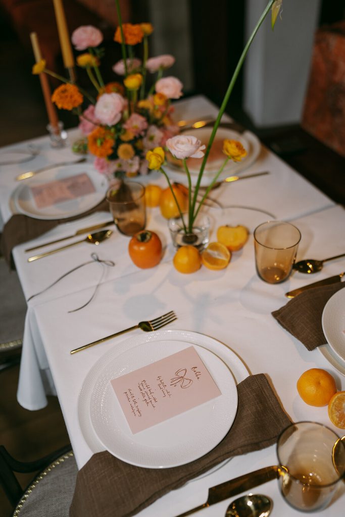 Colourful wedding scenes in a zesty palette of pinks, oranges and yellows at London's Yaatra Restaurant | Lynn Shapiro Photography