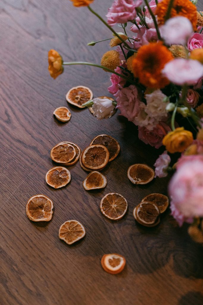 Colourful wedding scenes in a zesty palette of pinks, oranges and yellows at London's Yaatra Restaurant | Lynn Shapiro Photography
