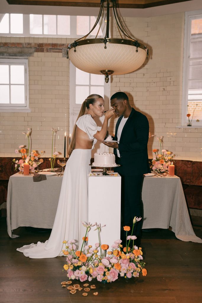 Colourful wedding scenes in a zesty palette of pinks, oranges and yellows at London's Yaatra Restaurant | Lynn Shapiro Photography