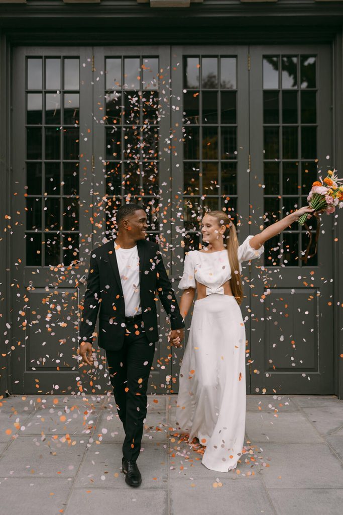 Colourful wedding scenes in a zesty palette of pinks, oranges and yellows at London's Yaatra Restaurant | Lynn Shapiro Photography