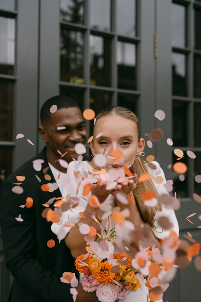 Colourful wedding scenes in a zesty palette of pinks, oranges and yellows at London's Yaatra Restaurant | Lynn Shapiro Photography