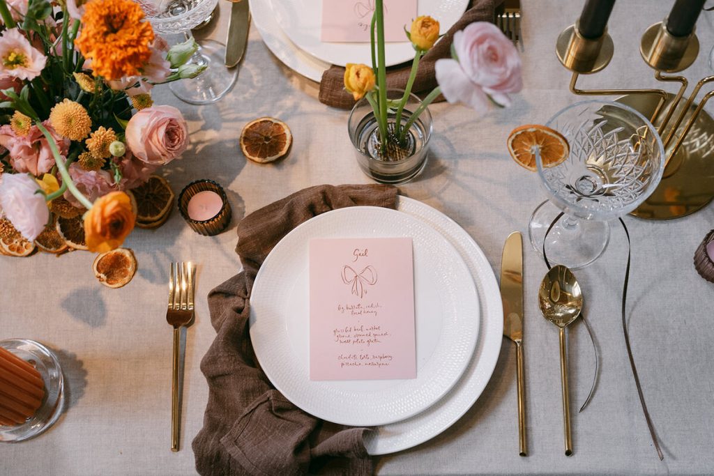 Colourful wedding scenes in a zesty palette of pinks, oranges and yellows at London's Yaatra Restaurant | Lynn Shapiro Photography