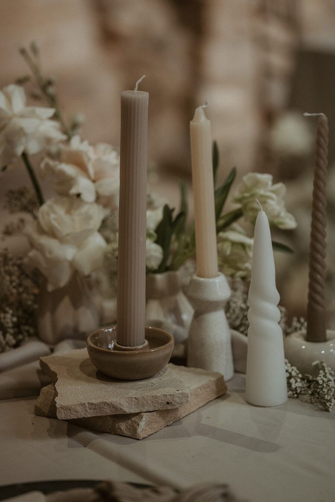 An earthy palette of stone, creams and whites for an ethereal, romantic wedding at Blackfriars Priory