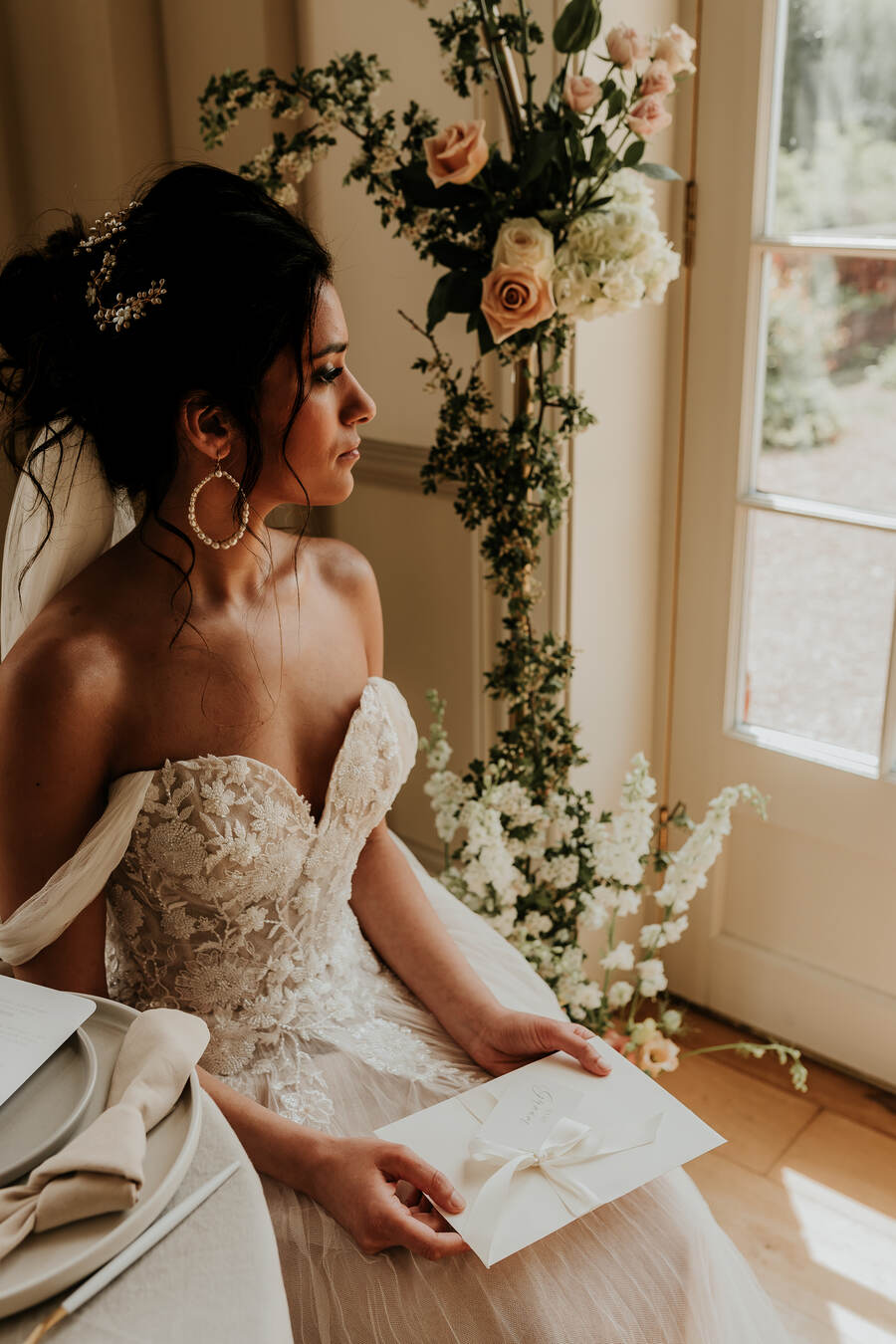 A romantic, elegant bridal look for a nude luxe wedding aesthetic at Hodsock Priory