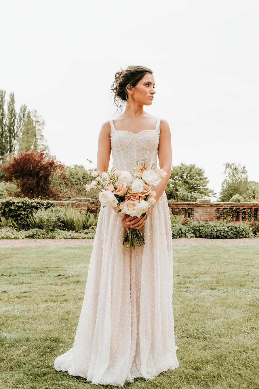 A romantic, elegant bridal look for a nude luxe wedding aesthetic at Hodsock Priory